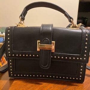 Black purse  with gold and silver accents